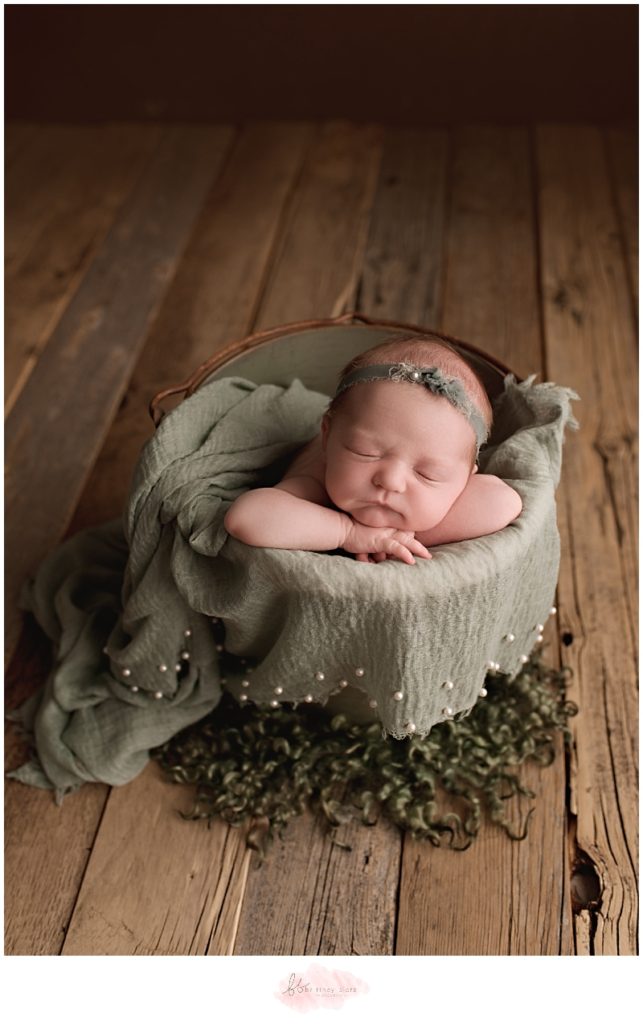 Calgary newborn photographer baby girl in green bucket